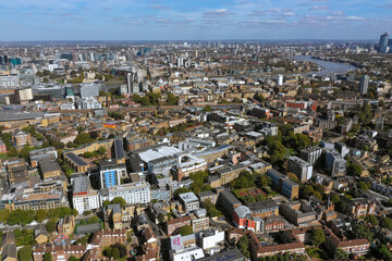 The River Thames winding through a sprawling London cityscape, emphasizing the cultural and historic heart of the capital