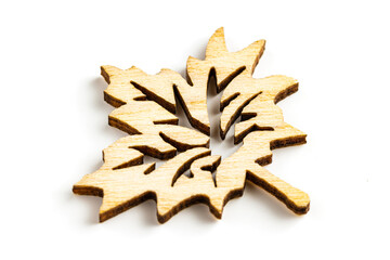 Close up macro shot of laser cut wooden leaf, isolated on white background.