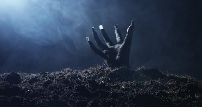 Zombie hand rising out from the ground
