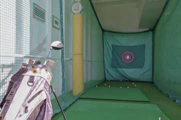 Golf tee shot simulator on outdoor sports deck of modern luxury ocean liner cruiseship cruise ship...