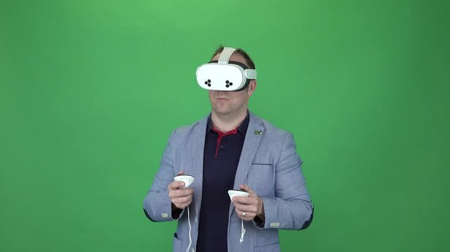 Young adult playing Meta Quest 3s. Green Screen background. Amazed by virtual reality.