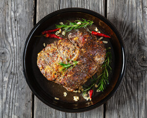 Juicy Roast Pork Neck on table, top view