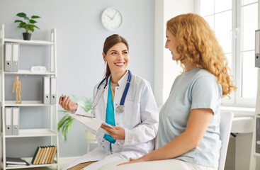 Happy smiling lady therapist professional consulting woman client in office, kind young doctor...