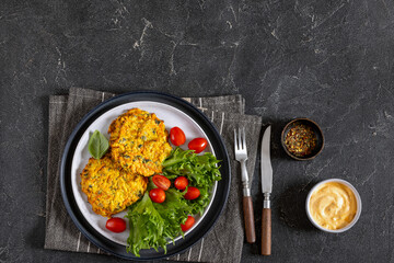 pumpkin carrot potato patties on plate, top view