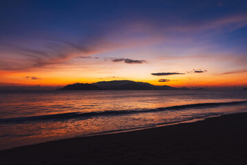 Sunrise. Clouds over the sea in the morning with orange, yellow sunlight
