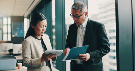Japanese, corporate and people with tablet in office for research, schedule planning and investors...