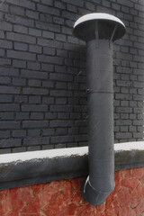 black ventilation pipe on black wall