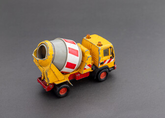 Miniature toy cement mixer truck. selective focus with copy space for text.