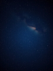 Dense cluster of stars forming a celestial map across a midnight blue sky, sparkling, dark