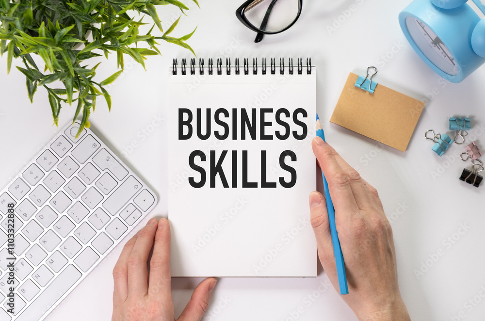 Poster business skills text on notebook with pen on grey background