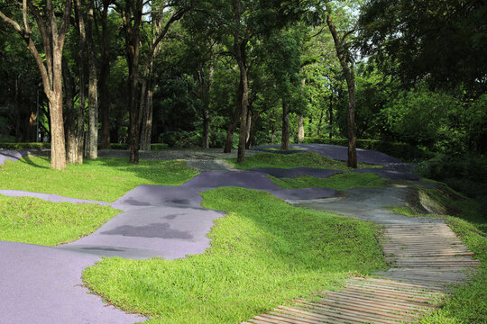 Black ethylene-propylene diene (EPDM) rubber track in the park. Balance bike lane for children.