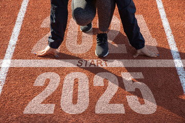 Starting to the new year 2025. woman preparing to start on an athletics track engraved with the year 2025. idea for planning, goals and New Year's resolutions.Adopting Success in 2025 for New Life.