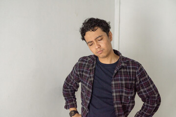 Man in Plaid Shirt Looking Down