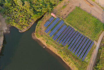 Drone view of solar panel near water reservoir. Aerial Shot of many 