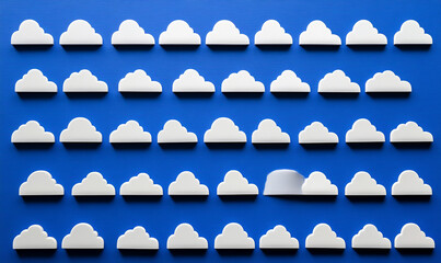 creative arrangement of white cloud shapes on vibrant blue background creates playful and whimsical atmosphere. This design evokes feelings of joy and imagination