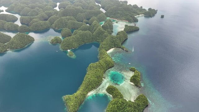 Aerial view of lush tropical islands and serene emerald sea, Coron, Philippines.