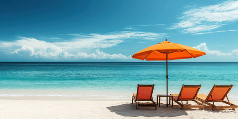 Fototapeta premium Tranquil tropical beach with orange umbrella and wooden lounge chairs