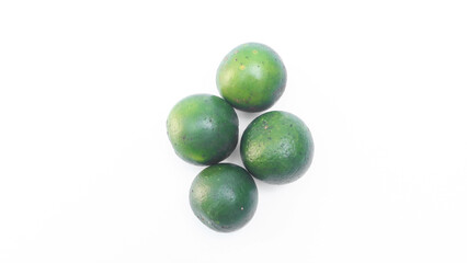 Local fresh squeezed orange fruit from Asia on white background. Green orange fruit for making drinks