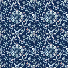 Granulation watercolour snowflakes on a blue background. Seamless winter pattern. Frost crystals drawings. Hand drawn illustration. For fabric, sketchbook, invitation decor, wallpaper, wrapping paper