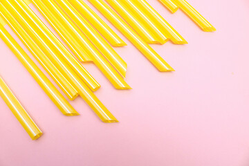 Close up Colorful row of plastic straws isolated on white background with blank space. Deep of field hole phot