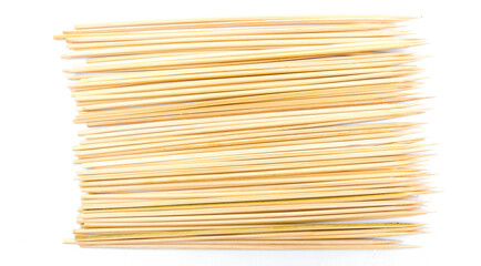 stack of bamboo skewers for making satay or barbeque on white background