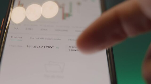 macro shot of a person analysing the trend of bitcoin over recent times