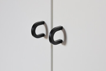 Minimalistic black wardrobe door handles