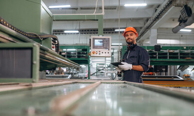 Production of the windows. Man is working in the modern factory
