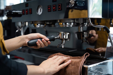 Barista Preparing Espresso with Professional Coffee Machine in Modern Cafe Setting