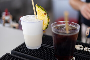 Refreshing cocktails served at a summer bar with tropical vibes and vibrant colors