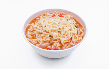 A bowl of spicy Gekikara ramen instant noodles with chili pieces isolated on white background