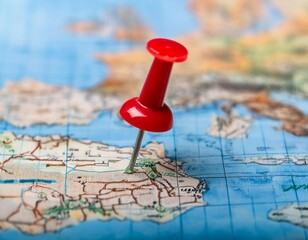 Marker pointing to a specific location on a map, representing geographic positioning and site identification.