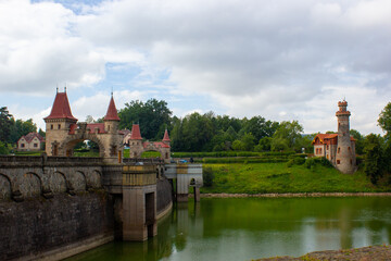 Fototapeta premium architectural structure, ancient dam with arches and red roofs in the Czech town of Hradec Králové