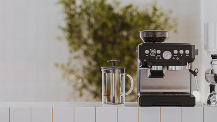 Coffee machine with french press on white tiled counter with blured cafe background, 3d render