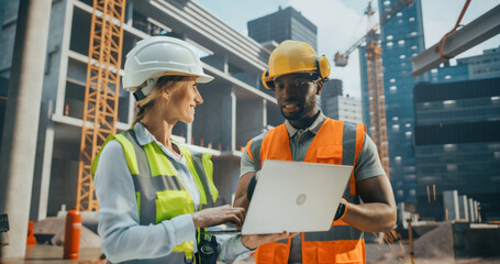 Site Manager Talking with African General Construction Operative at a Residential Building...