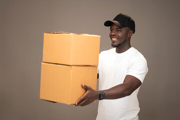 Young Black American Dispatch Rider Handling Out Box Packages with a Happy Expression

