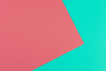 Two-tone color green and red colored paper background. Concept for image, text, and design. Geometric paper backdrop...