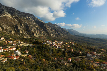 Ariel view of Kruje, Albania with mountains and houses.