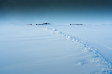 Snowy hill of summit on frozen glacier wilderness in Iceland