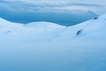 Snowy hill of summit on frozen glacier wilderness in Iceland