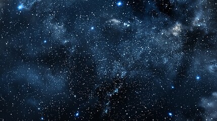 Naklejka premium A starry night sky with wisps of clouds.