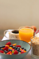 Assortment of various breakfast foods and drinks on the white table. Selective focus.