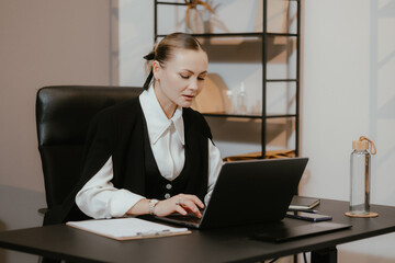 Professional Woman Working on Laptop in Office