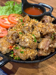 Deep fried pork rib bone with herb and chili.