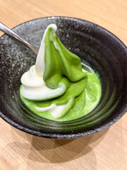 Delicious matcha and milk swirl soft serve ice cream.