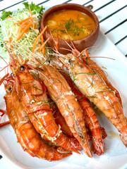 Grilled prawns served with spicy dip.