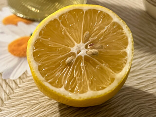 Close-up of a cut lemon lying on the table