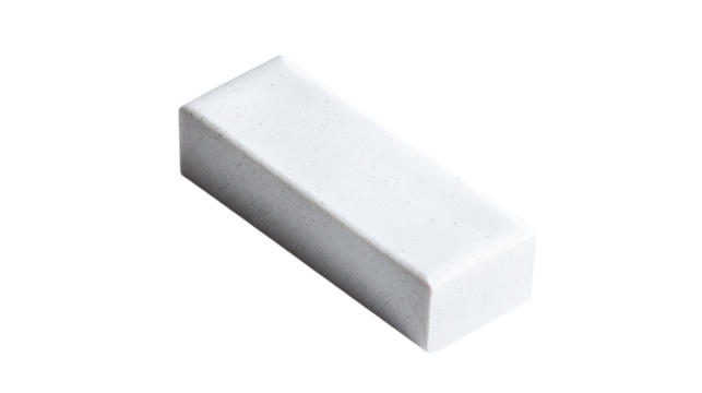A simple white eraser resting on a clean surface, ideal for correcting pencil marks in an office or classroom setting.