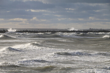 Stormy Baltic Sea with port piers in the distance, Europe, Latvia, Liepaja