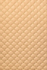 Fototapeta premium Intricate quilted texture showcasing warmth and softness in home decor